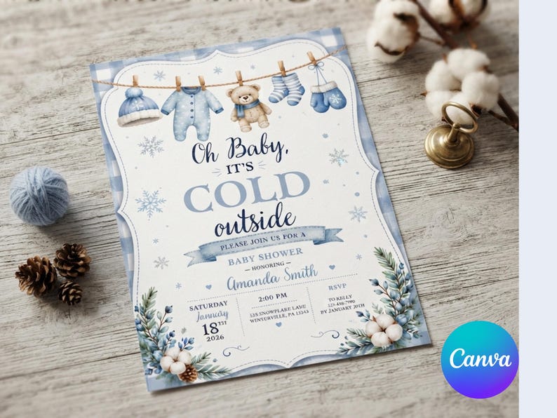 May include: A baby shower invitation card featuring a blue plaid border, snowflakes, and a clothesline with a hat, onesie, teddy bear, socks, and mittens. The text reads: Oh Baby, IT'S COLD outside, PLEASE JOIN US FOR A BABY SHOWER, Amanda Smith, January 18th, 2026.