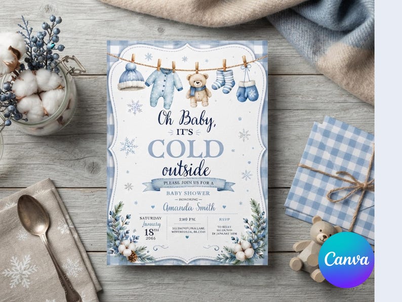 May include: A rectangular baby shower invitation card featuring a blue and white gingham border, a clothesline with winter baby clothes, and a teddy bear. The text reads: Oh Baby, IT'S COLD outside, PLEASE, JOIN US FOR A BABY SHOWER, HONORING, Amanda Smith.