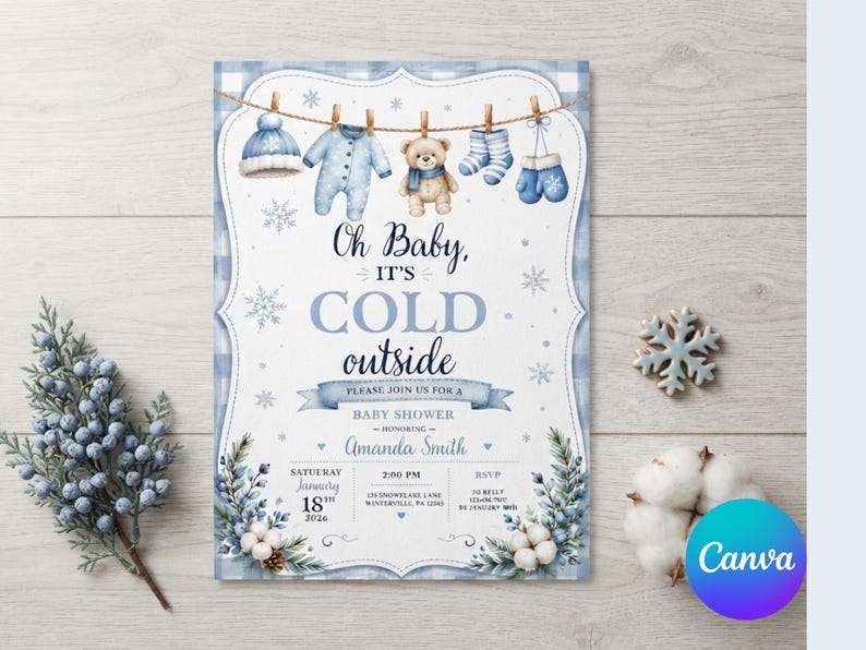 May include: A baby shower invitation card featuring a blue plaid border and a clothesline with a winter hat, onesie, teddy bear, socks, and mittens. The text reads Oh Baby, IT'S COLD outside, honoring Amanda Smith, Saturday January 18th 2024.