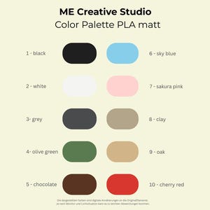 May include: Color palette featuring ten matte PLA colors, including black, white, grey, olive green, chocolate, sky blue, sakura pink, clay, oak, and cherry red. The colors are displayed in rounded rectangular shapes with corresponding numbers.
