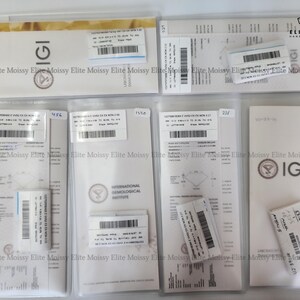 May include: A collection of IGI diamond grading reports and certificates in clear plastic sleeves. The reports feature barcodes, text, and the IGI logo. The certificates are in various sizes and shapes, with a gold and white color scheme.