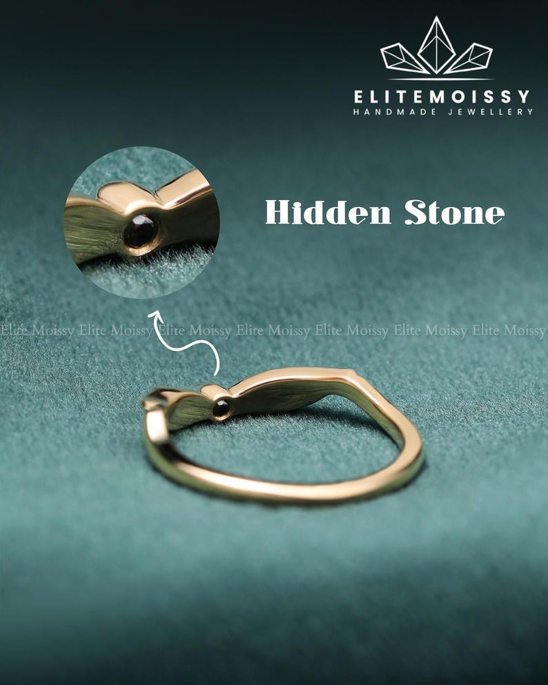 Engraved 14k gold wing band with filigree details, minimalist vintage inspired stacking wedding ring worn on finger.