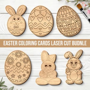 May include: A selection of laser-cut wooden Easter shapes, featuring bunnies and decorated eggs. The light brown shapes have etched designs, and the text "EASTER COLORING CARDS LASER CUT BUDNLE" is displayed in a banner.