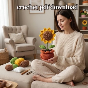 May include: A crocheted sunflower in an orange pot, held by a person. The sunflower has yellow petals and a brown center. Green leaves and a green stem are visible. The text "crochet pdf download" is at the top of the image. Yarn and crochet tools are nearby.