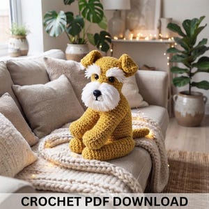 May include: A mustard yellow crocheted dog plush toy with a white bushy beard, white eyebrows, and dark eyes. The dog is sitting upright with its front paws resting on its lap. The text at the bottom of the image reads CROCHET PDF DOWNLOAD.