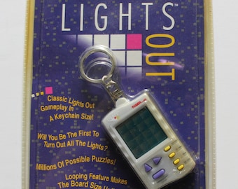 Vintage New Tiger Electronic Handheld Lights Out Keychain Game 1997