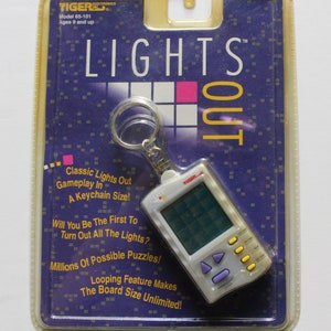 Vintage New Tiger Electronic Handheld Lights Out Keychain Game 1997