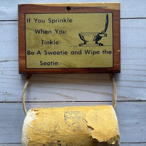 Vintage Be A Sweetie and Wipe The Seating Plaque Wall Mount Toilet Paper Holder with Laughing Tissue 1950s