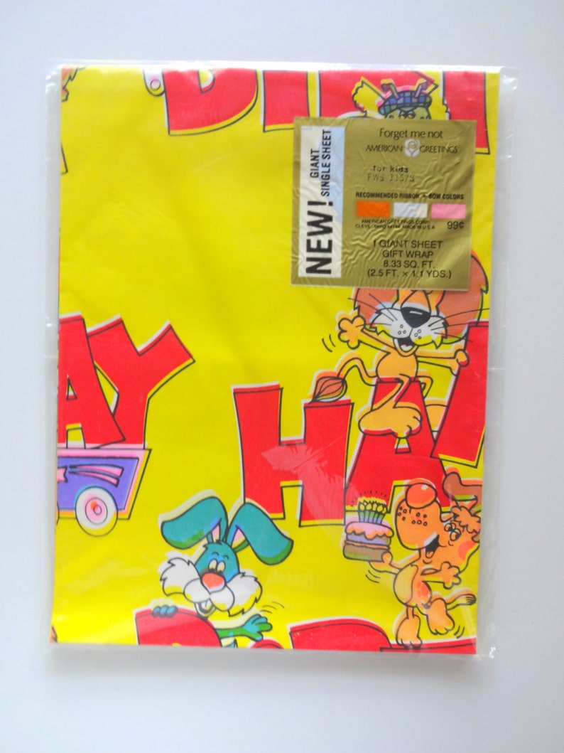 May include: A yellow and red birthday wrapping paper with a giant sheet size of 8.33 square feet. The paper features a cartoon design with animals and the words "Happy Birthday".