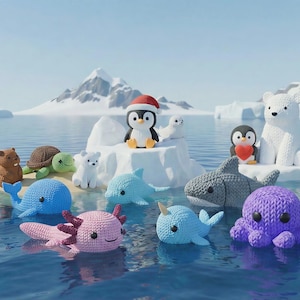 May include: A collection of crocheted aquatic and arctic animals floating in water. The assortment includes a penguin wearing a Santa hat, a polar bear, a shark, a whale, a turtle, and an axolotl. The background features snow-covered mountains and a blue sky.