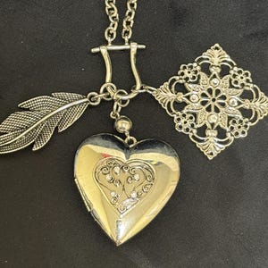 Signed Guess Heart Locket Necklace – Ornate Filigree, Feather Charms, Y2K Whimsical Goth Jewelry