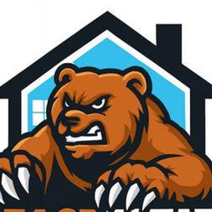 May include: A brown bear with an angry expression, sharp claws, and a black outline. The bear is positioned in front of a house silhouette with a blue background and white windows. The text "BEACH" is visible at the bottom.