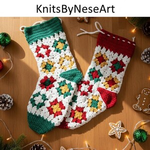 May include: Two handmade Christmas stockings with a granny square design. The stockings are white with red, green, and yellow floral patterns. The tops and heels are red and green. The text "KnitsByNeseArt" is at the top.