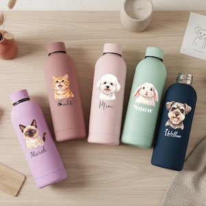May include: Five cylindrical metal water bottles in lavender, dusty rose, light pink, mint green, and navy blue. Each bottle features a printed illustration of a pet and a name: Marsh, Cookie, Mimi, Snow, and Willow, written in black script.