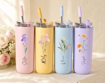 May include: Four cylindrical tumblers in pastel pink, yellow, light blue, and lavender, each featuring a floral illustration and a name: Stella, Lily, Olivia, and Hazel. Each tumbler includes a clear lid and a matching coloured straw.