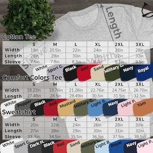 May include: A light gray t-shirt with a size chart for Cotton Tees, Comfort Colors Tees, and Sweatshirts. The chart displays measurements for width, length, and sleeve length in inches, along with color options.