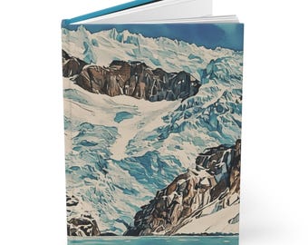 May include: A hardcover journal with a blue spine and a landscape image of a snow-covered mountain range. The cover art features a watercolor-style painting of a glacier, rocks, and a lake.