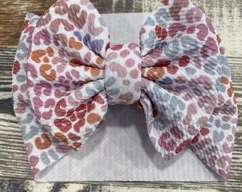 Multi-colored cheetah print bow style head wrap