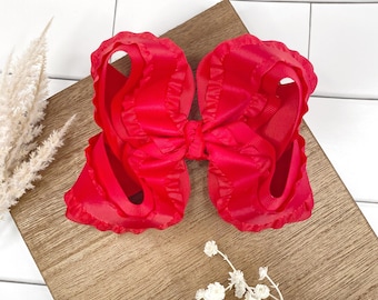Lazo rojo retorcido de boutique con volantes