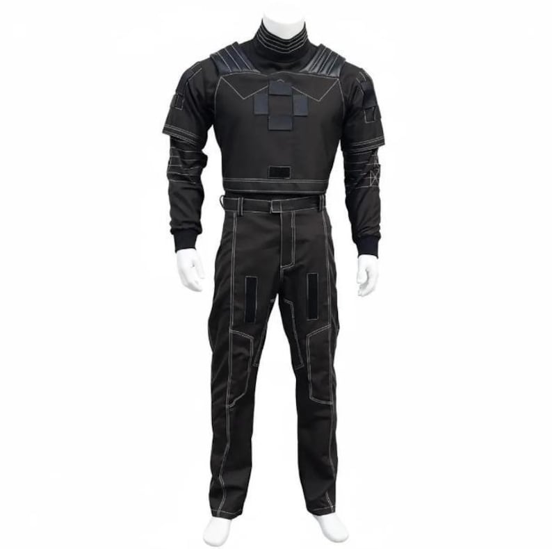 May include: A black tactical jumpsuit displayed on a mannequin. The outfit features a high collar, long sleeves, and pants with white stitching. The top has geometric patches, and the pants have reinforced knee and pocket areas. The jumpsuit is designed for a close fit.