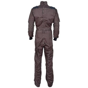May include: A dark brown jumpsuit featuring a high collar, long sleeves with black ribbed cuffs, and a waist belt. The garment is detailed with prominent light-colored topstitching along the seams and a geometric quilted pattern on the shoulders.