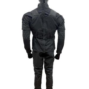 May include: A black tactical jacket and pants set. The jacket features reinforced shoulder and elbow patches, with a high collar and multiple pockets. The pants have a slim fit. The outfit is designed for durability and functionality.