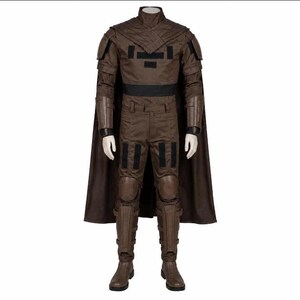 May include: A brown costume with a high collar, shoulder pads, and a black belt. The outfit includes a matching cape, pants, and boots. Black accents are visible on the chest and legs. The costume is designed for cosplay or themed events.