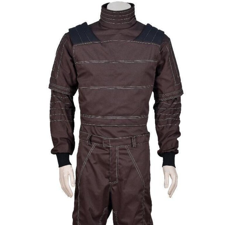 May include: A dark brown long-sleeved jumpsuit featuring a high mock neck collar, black shoulder panels, and prominent white horizontal topstitching across the chest, sleeves, and legs. The garment includes a waist belt and black ribbed cuffs.