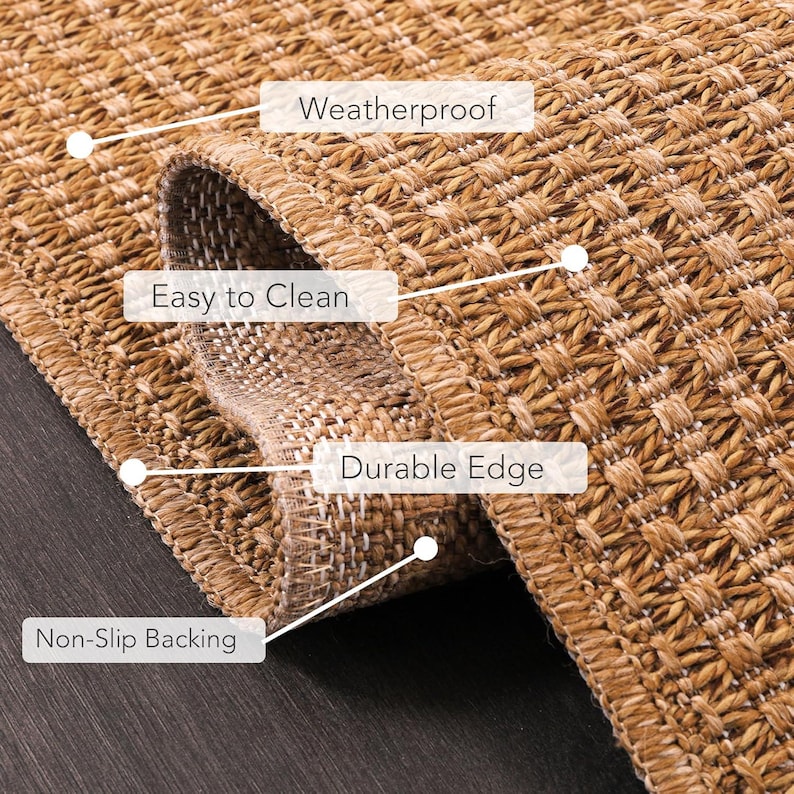 Beige indoor outdoor rug placed in a modern living room setting, complementing neutral-toned furniture and wood flooring. The polypropylene material is weatherproof, washable, and easy to maintain, making it ideal for everyday use in busy homes.