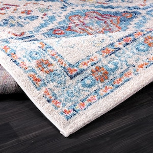 Boho entryway rug styled in modern living room with plants