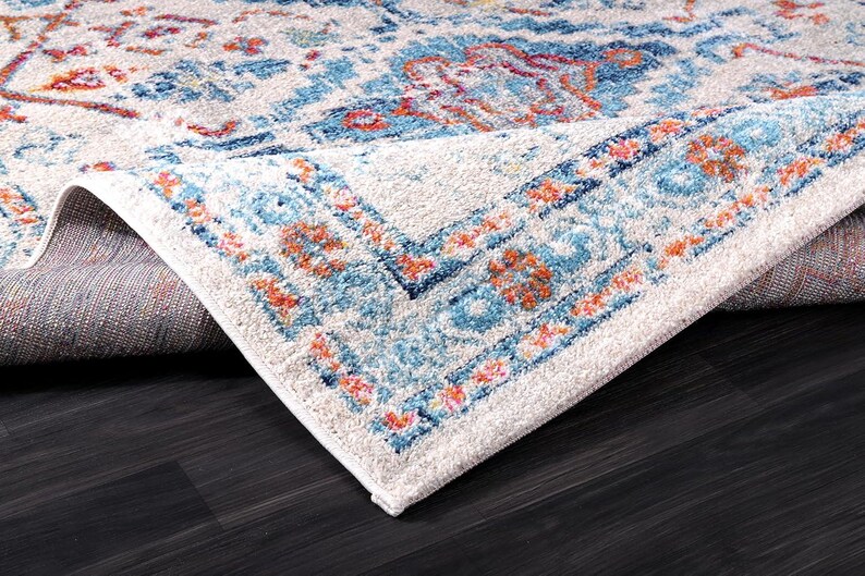 Boho entryway rug styled in modern living room with plants