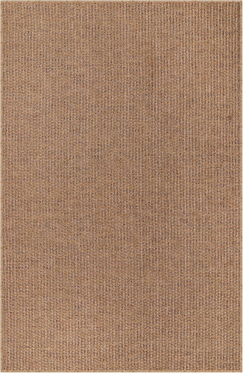 Outdoor patio scene with a modern beige rug under a seating set. The rug is UV-resistant, water-repellent, and perfect for year-round use on balconies, decks, or terraces. Crafted from 100% polypropylene with a subtle woven pattern.