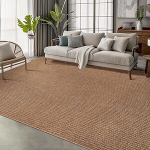 Stylish bathroom setup with a beige indoor outdoor rug outside a bathtub. The washable and quick-drying design is ideal for moisture-prone spaces without sacrificing style.