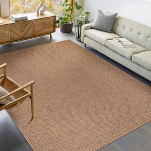 Modern home office setup with a neutral-tone rug beneath a desk and chair. Supports a comfortable, productive workspace while being easy to clean and resistant to wear from rolling chairs.