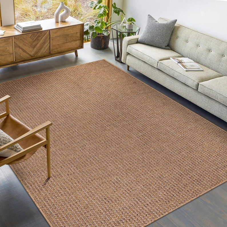 Modern home office setup with a neutral-tone rug beneath a desk and chair. Supports a comfortable, productive workspace while being easy to clean and resistant to wear from rolling chairs.