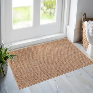 Kitchen interior featuring a weatherproof beige rug in front of white cabinets. The non-slip backing and low pile design make it safe and practical in food prep areas, while the easy-to-clean surface offers everyday convenience.