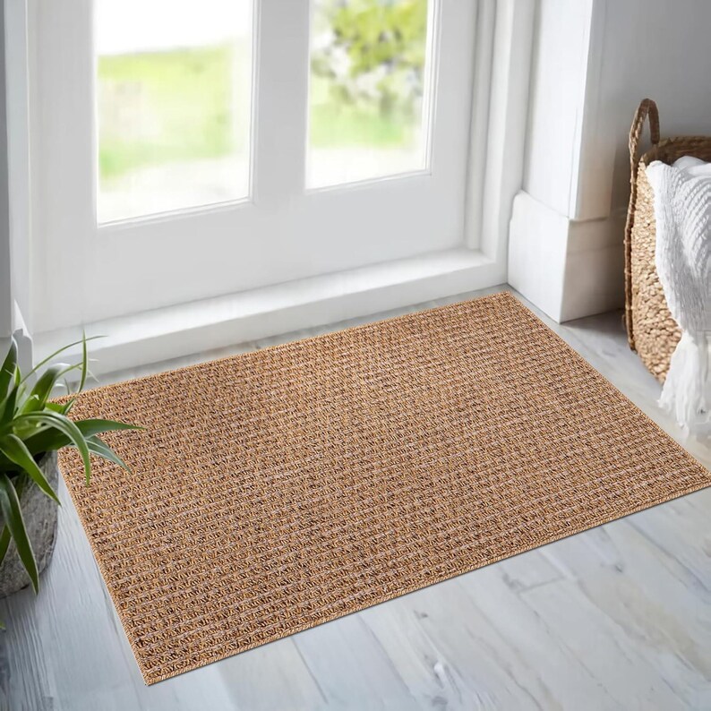 Kitchen interior featuring a weatherproof beige rug in front of white cabinets. The non-slip backing and low pile design make it safe and practical in food prep areas, while the easy-to-clean surface offers everyday convenience.