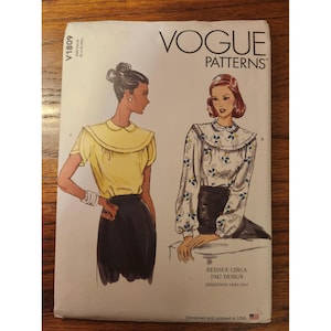 May include: A Vogue Patterns sewing pattern envelope, V1809, featuring illustrations of two blouse designs with collars. One blouse is solid yellow, the other has a blue and yellow floral print. Text includes Reissue Circa 1947 Design and Designed and printed in USA.