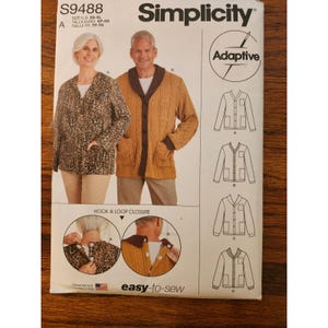 May include: Simplicity sewing pattern S9488 for adaptive jackets. The pattern features illustrations of the finished garments, including a leopard print jacket and a brown cable-knit cardigan. The pattern includes hook and loop closure instructions and is easy-to-sew.