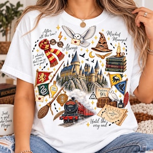 May include: A white t-shirt featuring a colorful graphic print of a castle, a red steam train, a snowy owl, a sorting hat, a striped scarf, and various magical items. The text includes "After all this time?", "Always", "Mischief Managed", and "Platform 9 3/4".