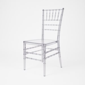 May include: A clear, transparent Chiavari chair with a bamboo-style design. The chair features a square seat, a supportive back, and four legs. The chair is made of a durable, transparent material, perfect for events and gatherings.