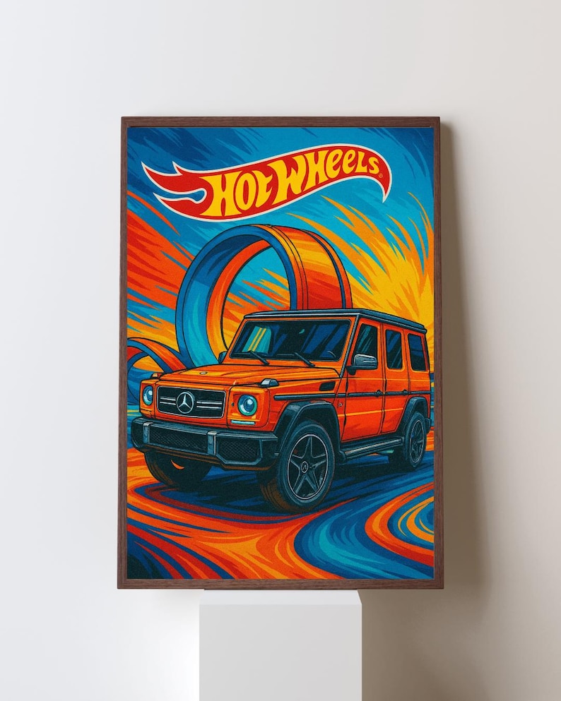 May include: A framed print featuring an orange Hot Wheels car with black accents, set against a vibrant backdrop of blue, orange, and yellow streaks. The Hot Wheels logo is displayed at the top.