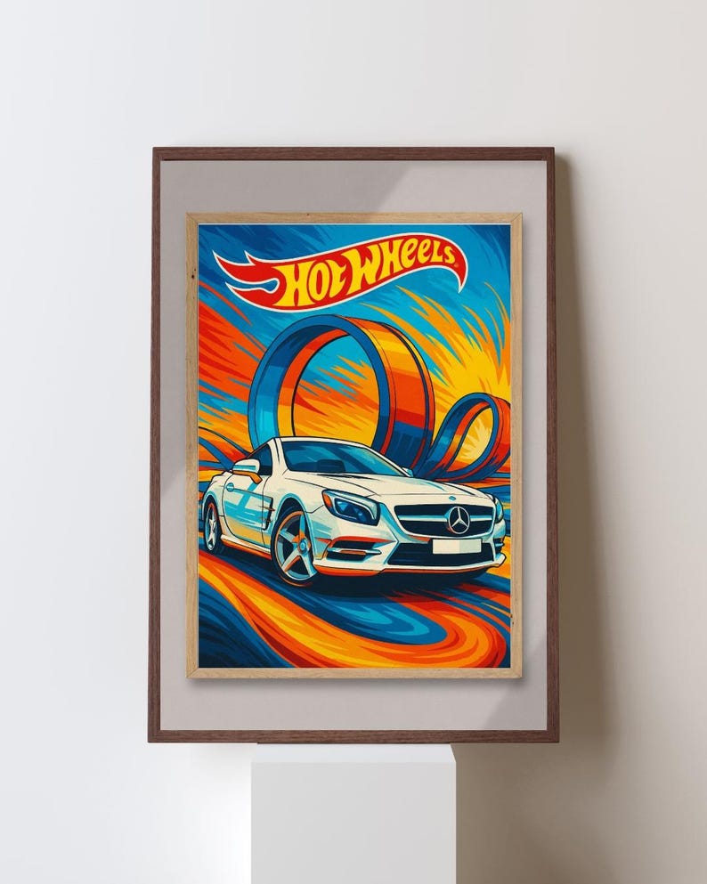 May include: A framed print featuring a white sports car with the Hot Wheels logo. The artwork has a dynamic design with blue, orange, and yellow swirls, and a loop-de-loop track. The print is in a brown frame.