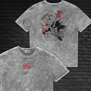 May include: A grey acid-wash t-shirt featuring a small red and black graphic on the chest with the text "ONE PROTECTOR". The back displays a large black and red anime-style illustration of a character with a sword and the text "ONE PROTECTOR".