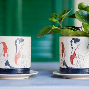 Hand-painted ceramic planter with sequential illustrations of a forward roll with a drainage hole and saucer image 4