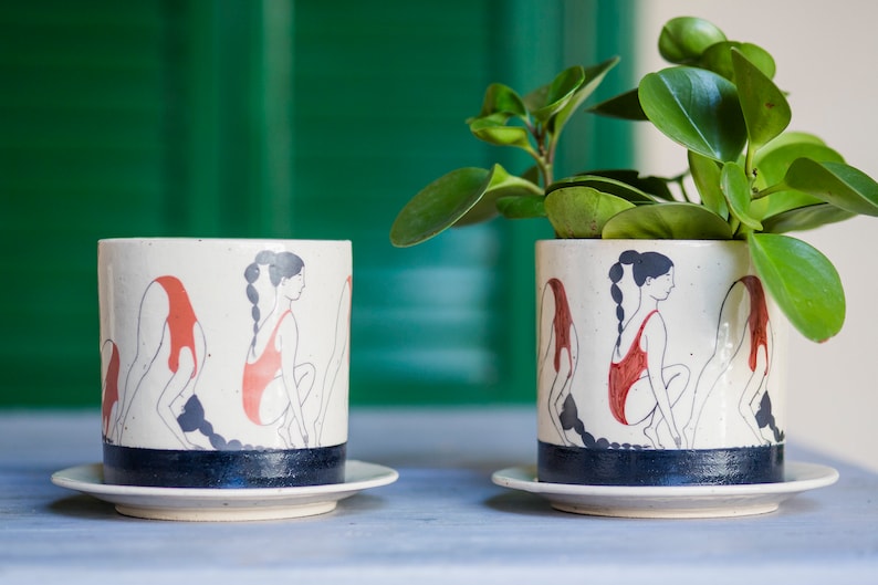 Hand-painted ceramic planter with sequential illustrations of a forward roll with a drainage hole and saucer image 4