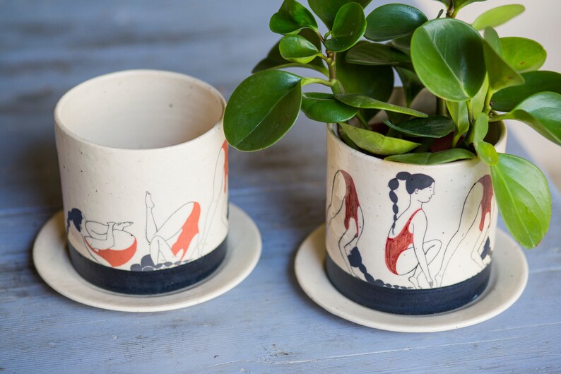 Hand-painted ceramic planter with sequential illustrations of a forward roll with a drainage hole and saucer image 3