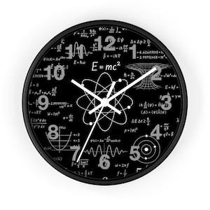 May include: A round wall clock with a black face featuring white physics equations, mathematical formulas, and the E=mc2 equation. The clock has large grey numbers from 1 to 12, a central white atom diagram, and three thin white clock hands.