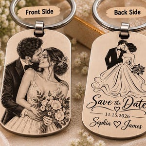 May include: Two rectangular metal keychains with rounded corners. The left keychain features an engraved portrait of a couple in wedding attire. The right keychain displays an engraved illustration of a bride and groom with the text Save the Date 11.15.2026 Sophia and James.
