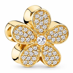 May include: A gold-toned flower charm featuring five rounded petals. Each petal is densely encrusted with small, clear, sparkling stones. A single, larger, brilliant-cut clear stone is set in the center of the flower, surrounded by the petals.